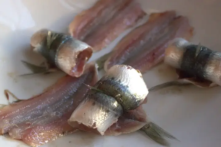 Sardines arranged on a serving plate