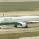 Commercial aircraft taxiing on the runway at Taoyuan International Airport in Taiwan
