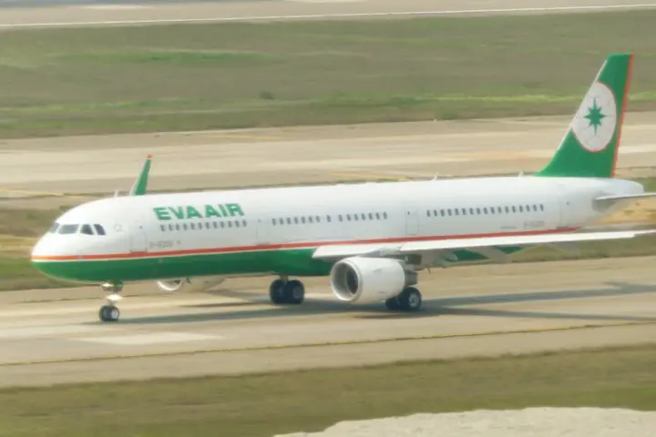 Commercial aircraft taxiing on the runway at Taoyuan International Airport in Taiwan