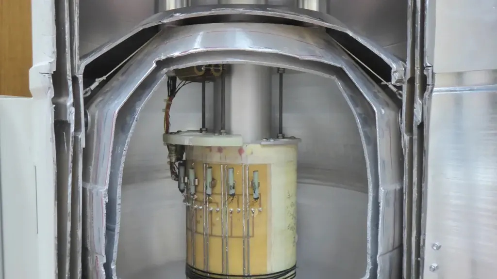 Cutaway view of a superconducting magnet and cryostat assembly used to trap and study charged particles