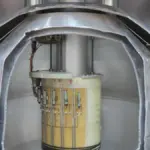 Cutaway view of a superconducting magnet and cryostat assembly used to trap and study charged particles