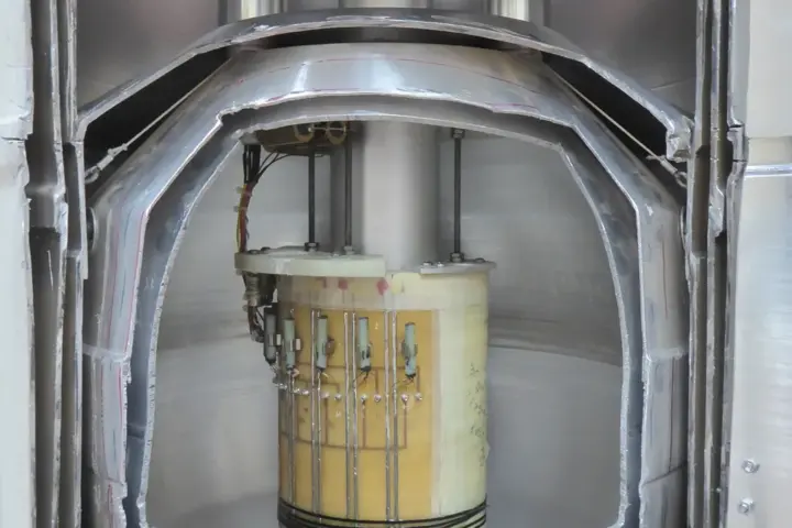 Cutaway view of a superconducting magnet and cryostat assembly used to trap and study charged particles
