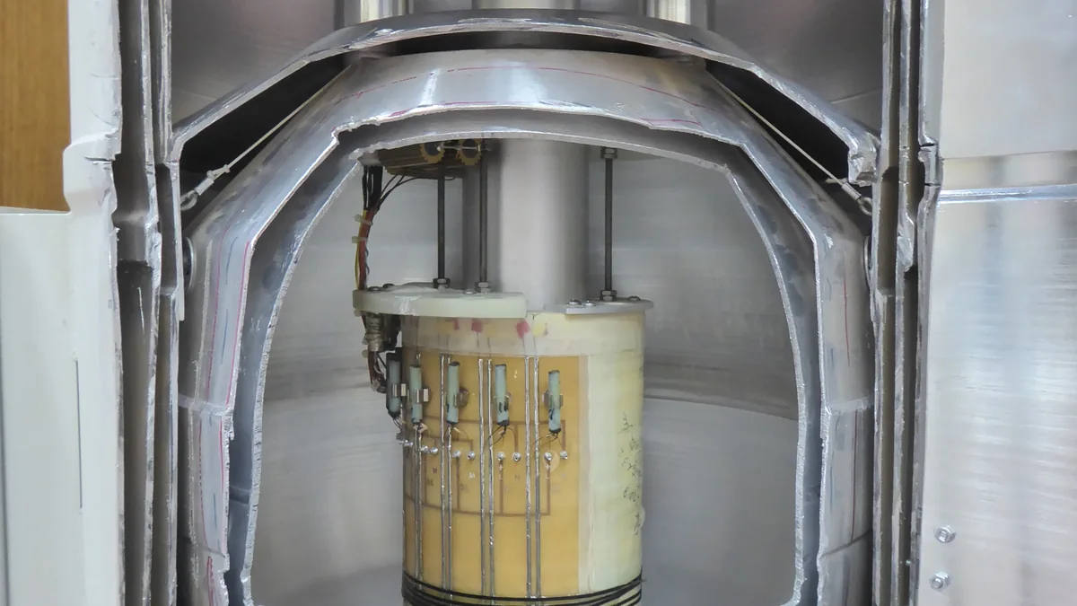Cutaway view of a superconducting magnet and cryostat assembly used to trap and study charged particles