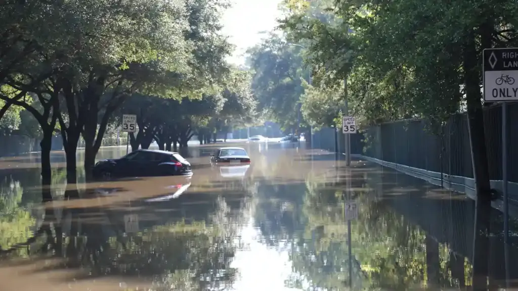 Cars floating on a flooded street in Houston, Texas