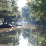 Cars floating on a flooded street in Houston, Texas