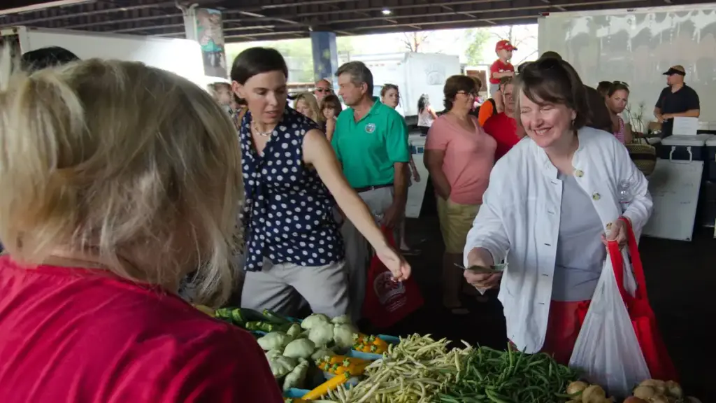 USDA photograph showing an EBT transaction at a Baltimore farmers market with fresh produce