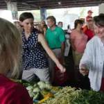 USDA photograph showing an EBT transaction at a Baltimore farmers market with fresh produce