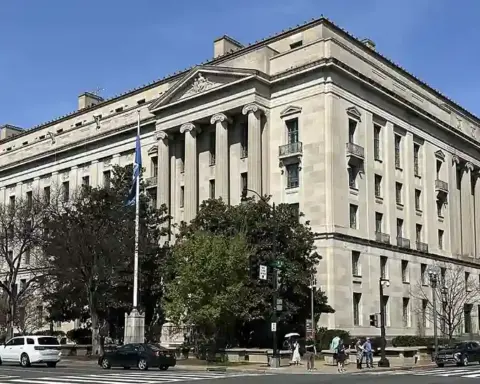 Exterior facade and classical colonnade of the Robert F. Kennedy Department of Justice headquarters building in Washington, D.C.