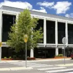 The Reserve Bank of Australia building in Canberra featuring structured concrete and glass architecture under daylight.