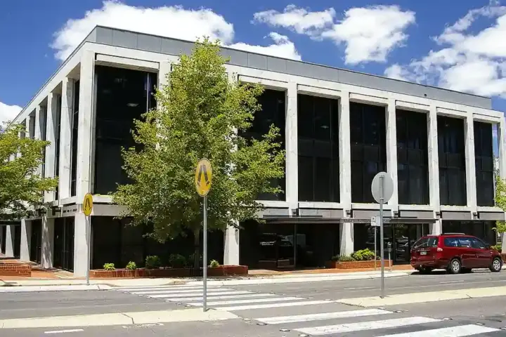 The Reserve Bank of Australia building in Canberra featuring structured concrete and glass architecture under daylight.