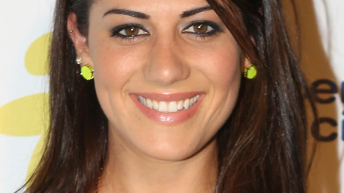 Close-up portrait of Australian former Olympic swimmer Stephanie Rice smiling at a Sydney public appearance.