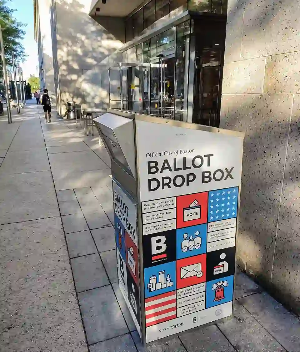 A secured ballot box situated inside an official election polling station.
