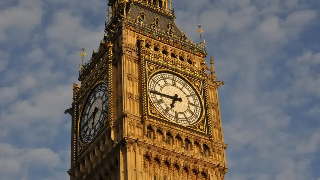 Detailed view of the clock face of Big Ben's Elizabeth Tower against a cloudy London sky