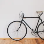A bicycle shown in close-up with its frame and saddle visible.