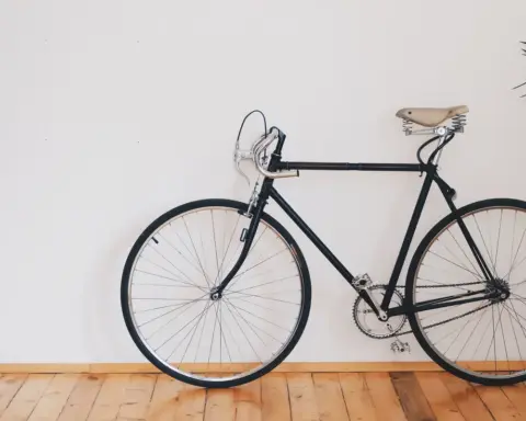 A bicycle shown in close-up with its frame and saddle visible.
