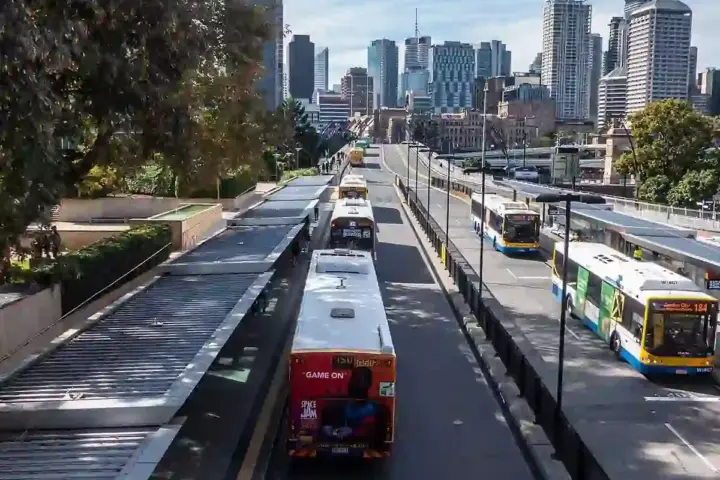 Buses queuing at the Cultural Centre busway station platform in South Brisbane, Australia.