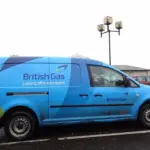 A blue British Gas fleet service vehicle parked along a residential pavement in the United Kingdom.