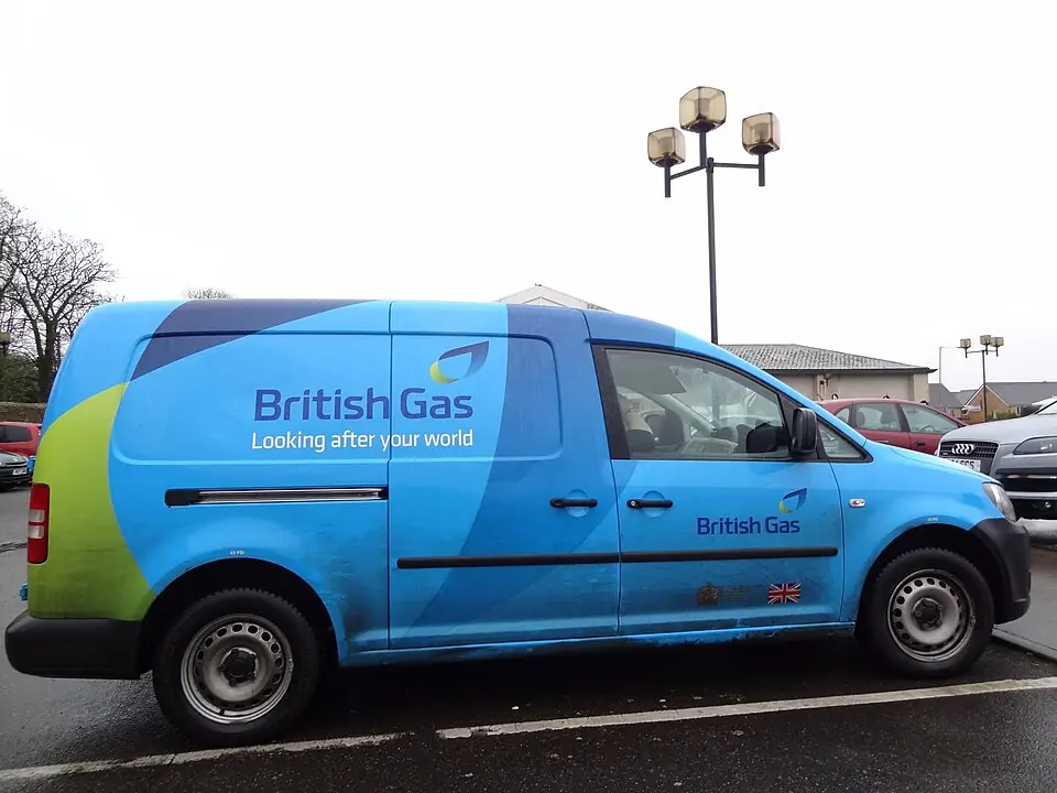 A blue British Gas fleet service vehicle parked along a residential pavement in the United Kingdom.