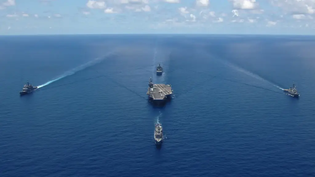 US Navy aircraft carrier George Washington sailing in formation with escort ships during a photo exercise