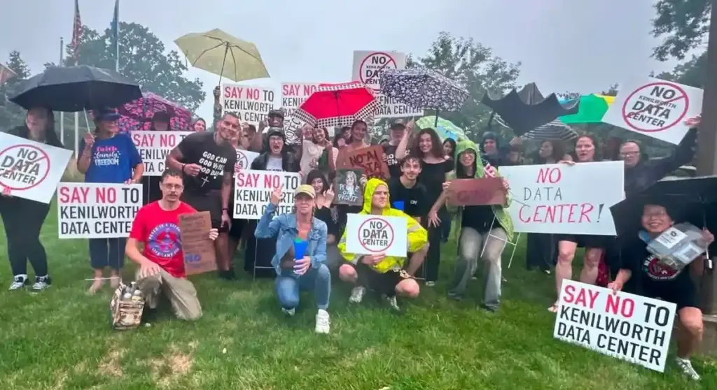 Protesters holding NO DATA CENTER signs