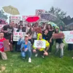 Protesters holding NO DATA CENTER signs