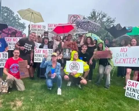 Protesters holding NO DATA CENTER signs