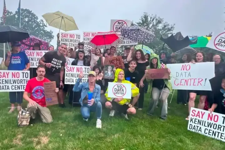 Protesters holding NO DATA CENTER signs