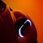 Close-up of a Citroen concept car headlight with a curved LED signature