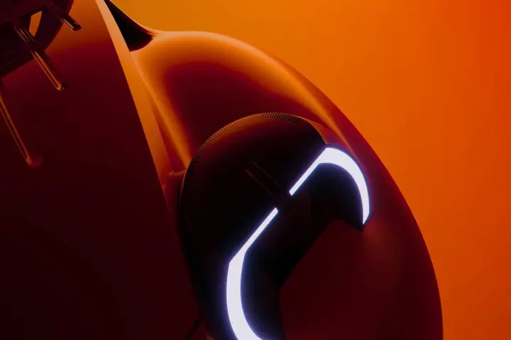 Close-up of a Citroen concept car headlight with a curved LED signature