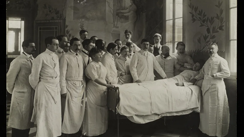 Medical staff consulting a female patient