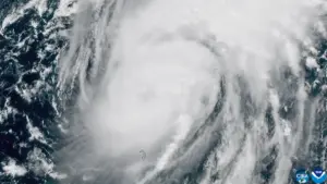High-resolution meteorological satellite view showing the organized cloud canopy and eye of Category 3 Hurricane Isaias over the Gulf of Mexico.
