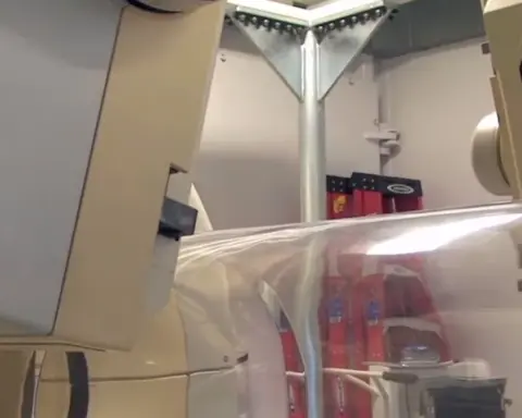 Cleanroom laboratory environment with high-precision imaging and molecular analysis equipment at the National Institutes of Health.
