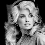 Black-and-white publicity portrait of Dolly Parton from 1977.
