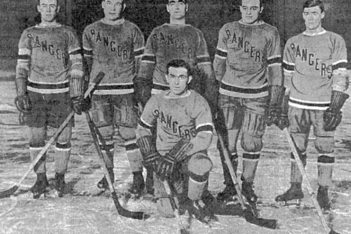 Historic black and white photograph of New York Rangers ice hockey players in team jerseys on the rink