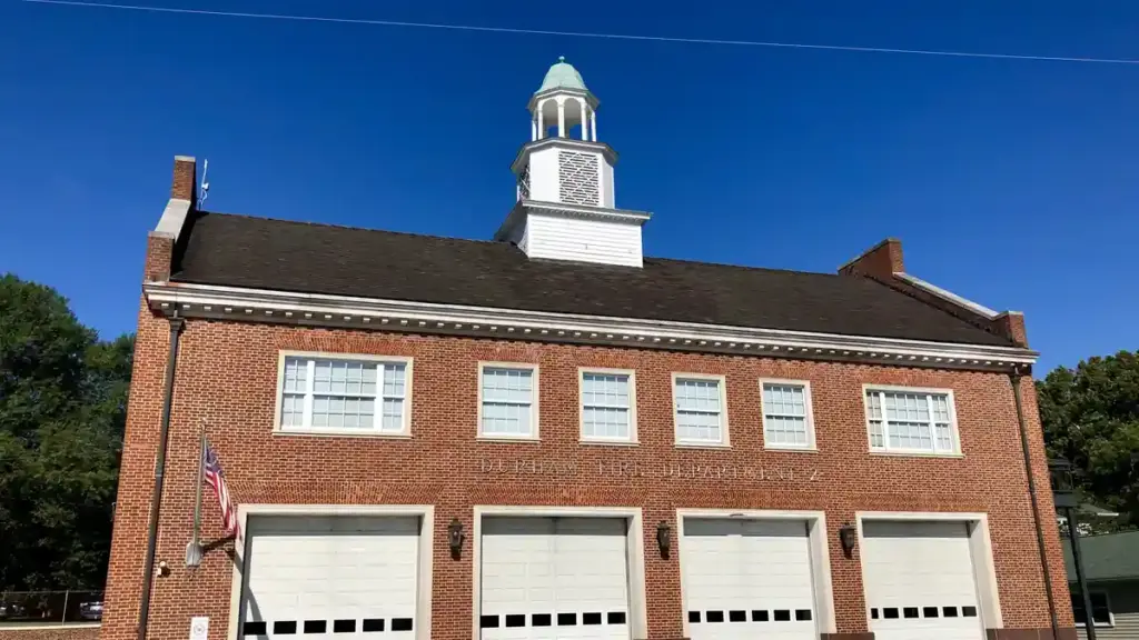 Exterior brick facade of a municipal Durham Fire Department station in North Carolina.