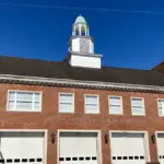 Exterior brick facade of a municipal Durham Fire Department station in North Carolina.