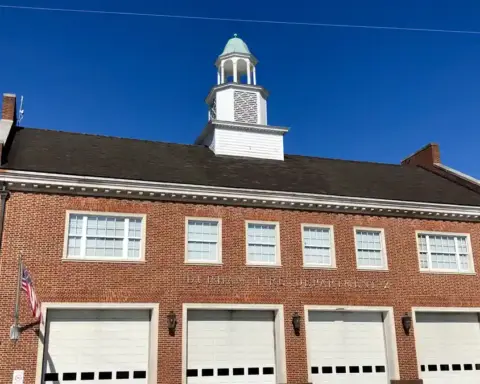 Exterior brick facade of a municipal Durham Fire Department station in North Carolina.