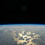 Earth's thin blue atmosphere and ocean horizon viewed from the International Space Station.
