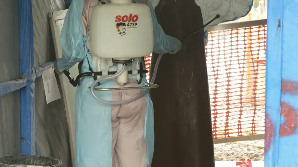 A medical isolation ward or treatment unit with healthcare workers