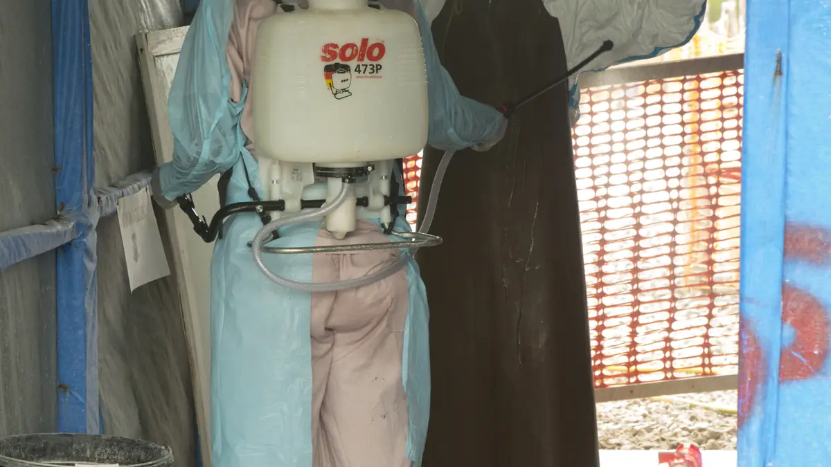 A medical isolation ward or treatment unit with healthcare workers