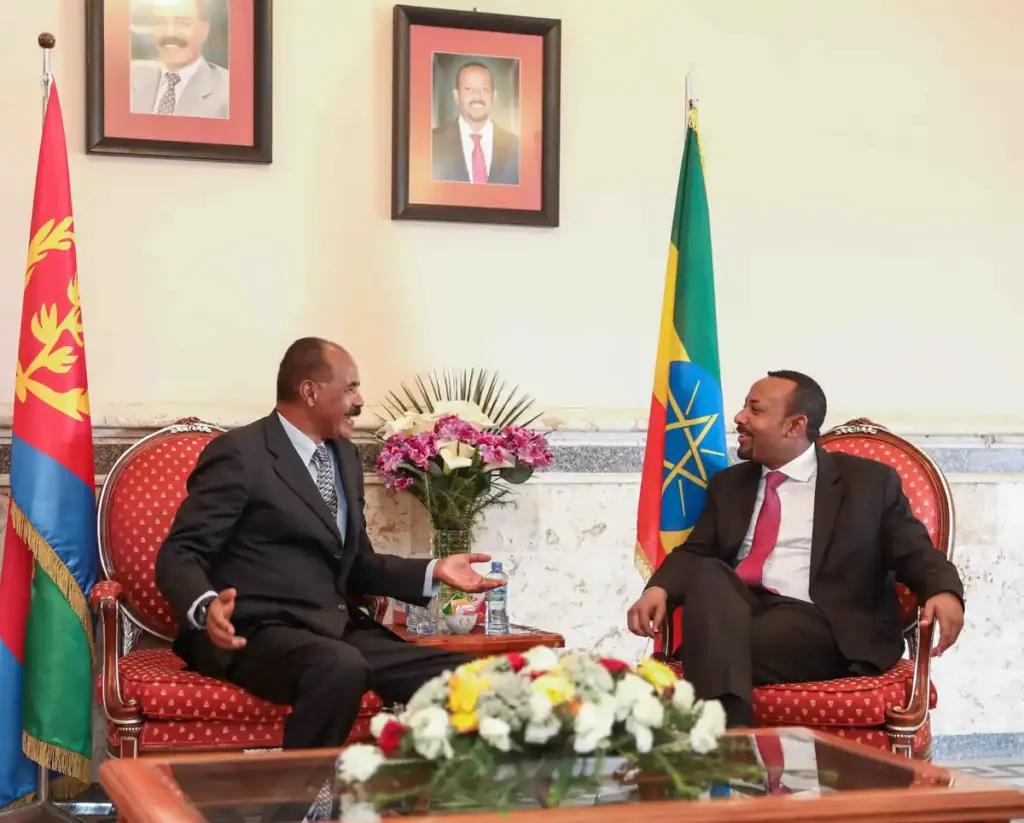 Ethiopian Prime Minister Abiy Ahmed and Eritrean President Isaias Afwerki speaking together in Eritrea in 2019, representing diplomatic relations between the two Horn of Africa nations