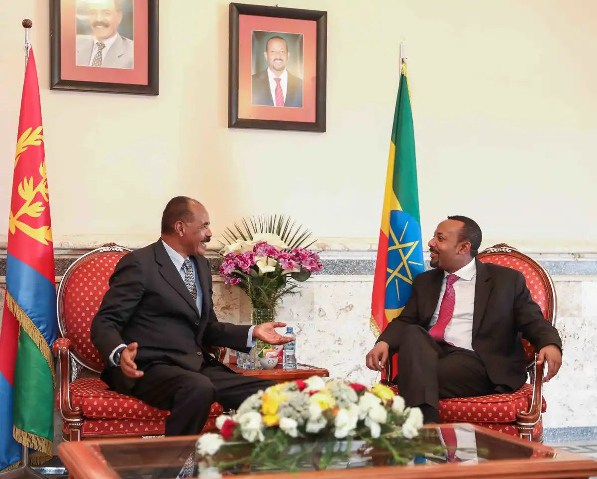 Ethiopian Prime Minister Abiy Ahmed and Eritrean President Isaias Afwerki speaking together in Eritrea in 2019, representing diplomatic relations between the two Horn of Africa nations