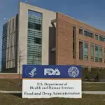 Exterior view of the U.S. Food and Drug Administration Building 21 entrance sign at the White Oak Federal Research Center.