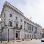 Exterior of the John Minor Wisdom U.S. Court of Appeals building in New Orleans with columns and columns reading Fifth Circuit