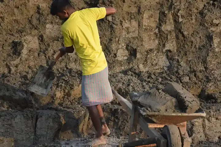 Workers at an industrial facility in India representing labor conditions
