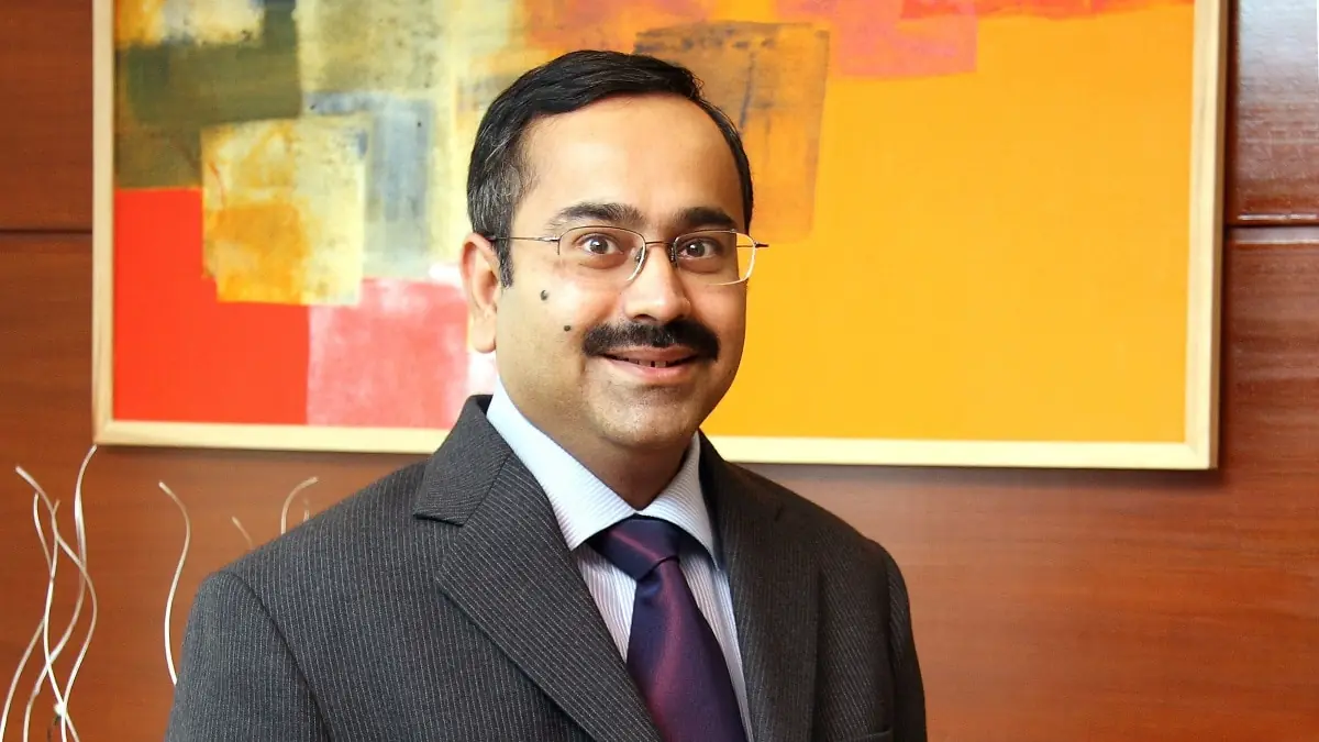 Anup Bagchi wearing spectacles and a business suit during an executive corporate portrait session representing HDFC Bank leadership transition