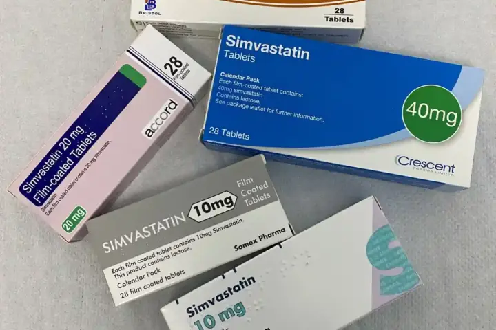 Blister packs and bottles of simvastatin cholesterol-lowering tablets.