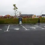 Electric vehicle charging points with BP Pulse stations and cables, illustrating infrastructure for EV adoption.