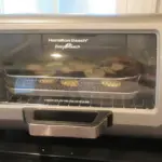 Countertop oven using an air fryer function illustrating the Kalorik MAXX safety warning