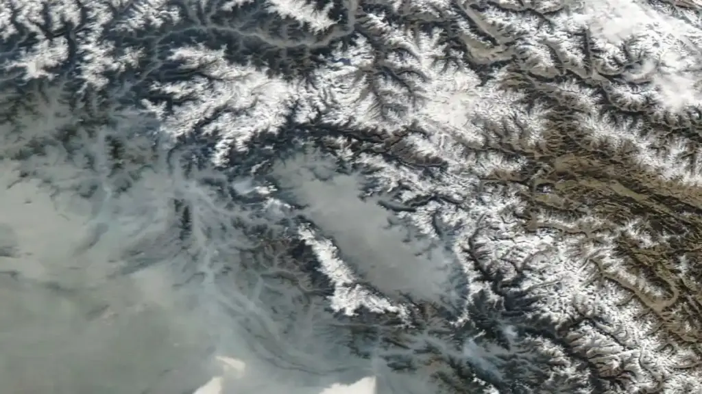 Satellite image showing the Kashmir Valley with mountain ranges and agricultural plains under clear weather conditions